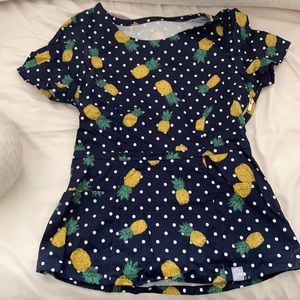 Jaanuu pineapple peplum scrub top